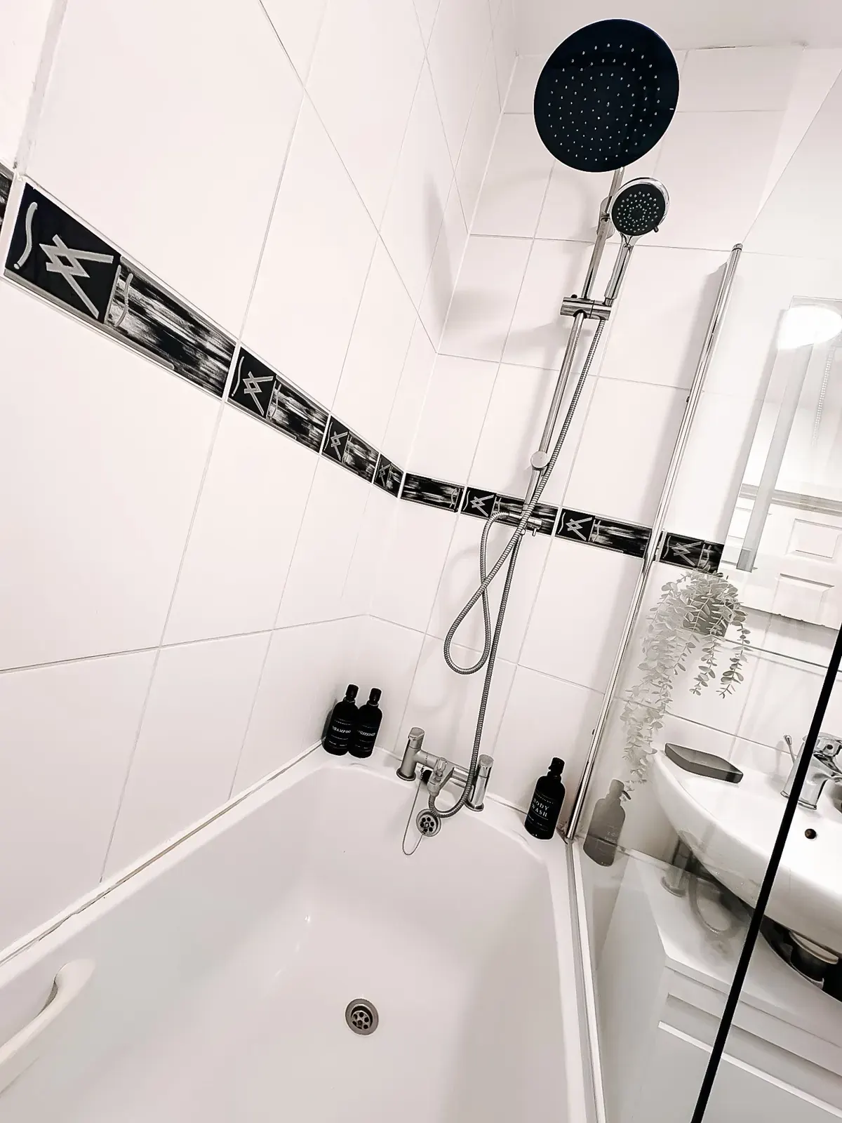 Bathroom with a rainfall shower over the bath