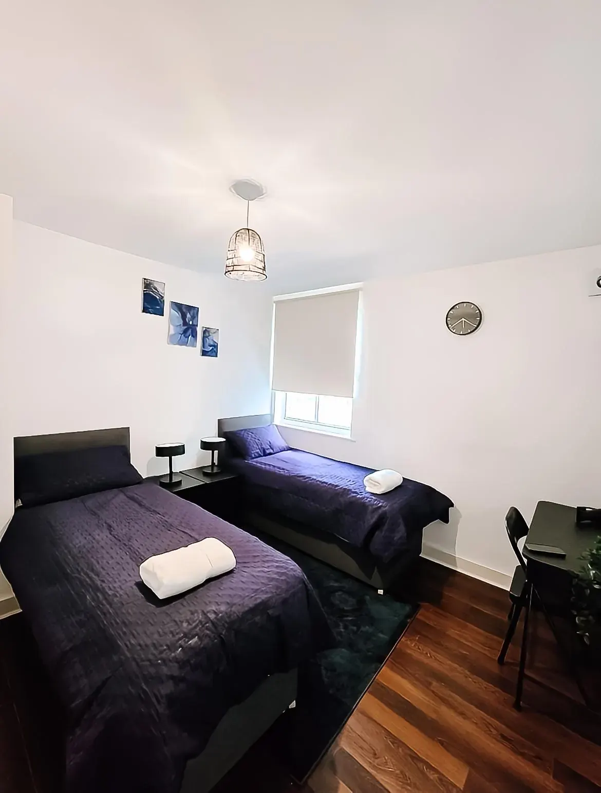 The bedroom set up with two single beds