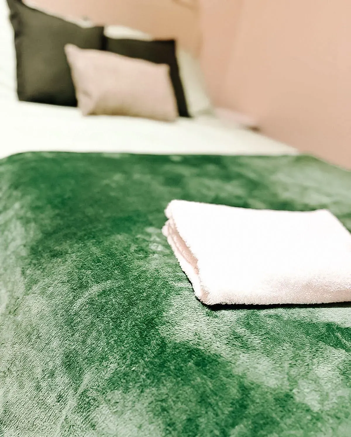 Folded towel on the green throw