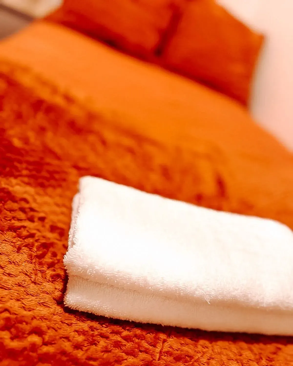 Towel on the orange bedding