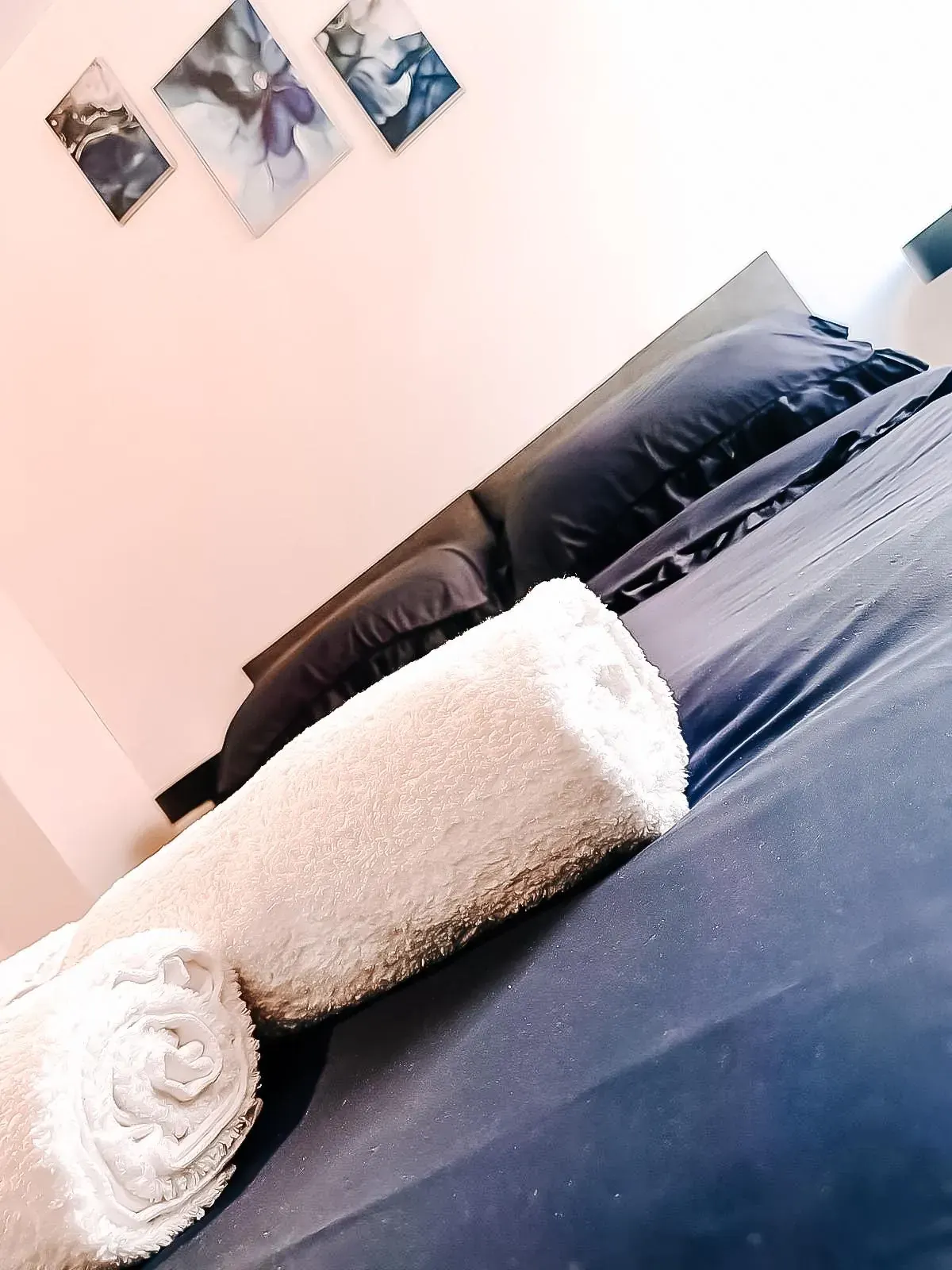 Fresh towels folded on the bed
