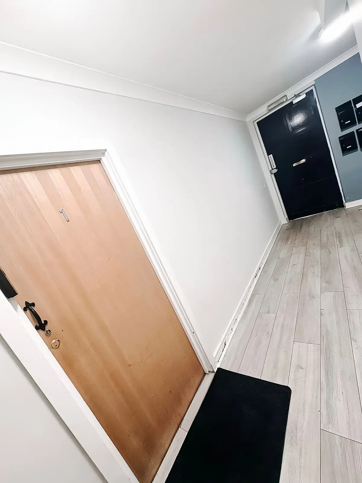 The communal hallway leading to the flat door
