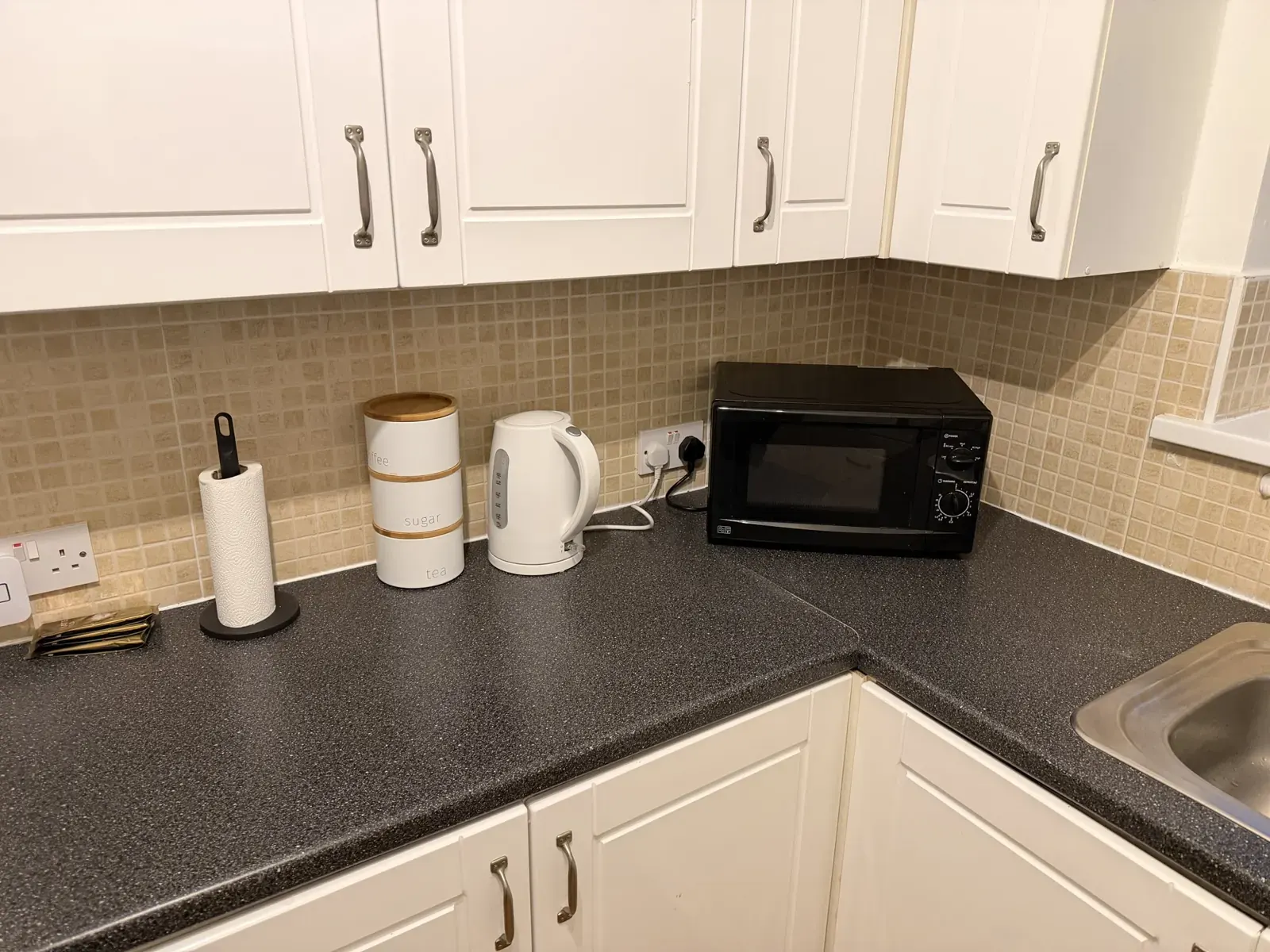 Microwave and kettle on the worktop