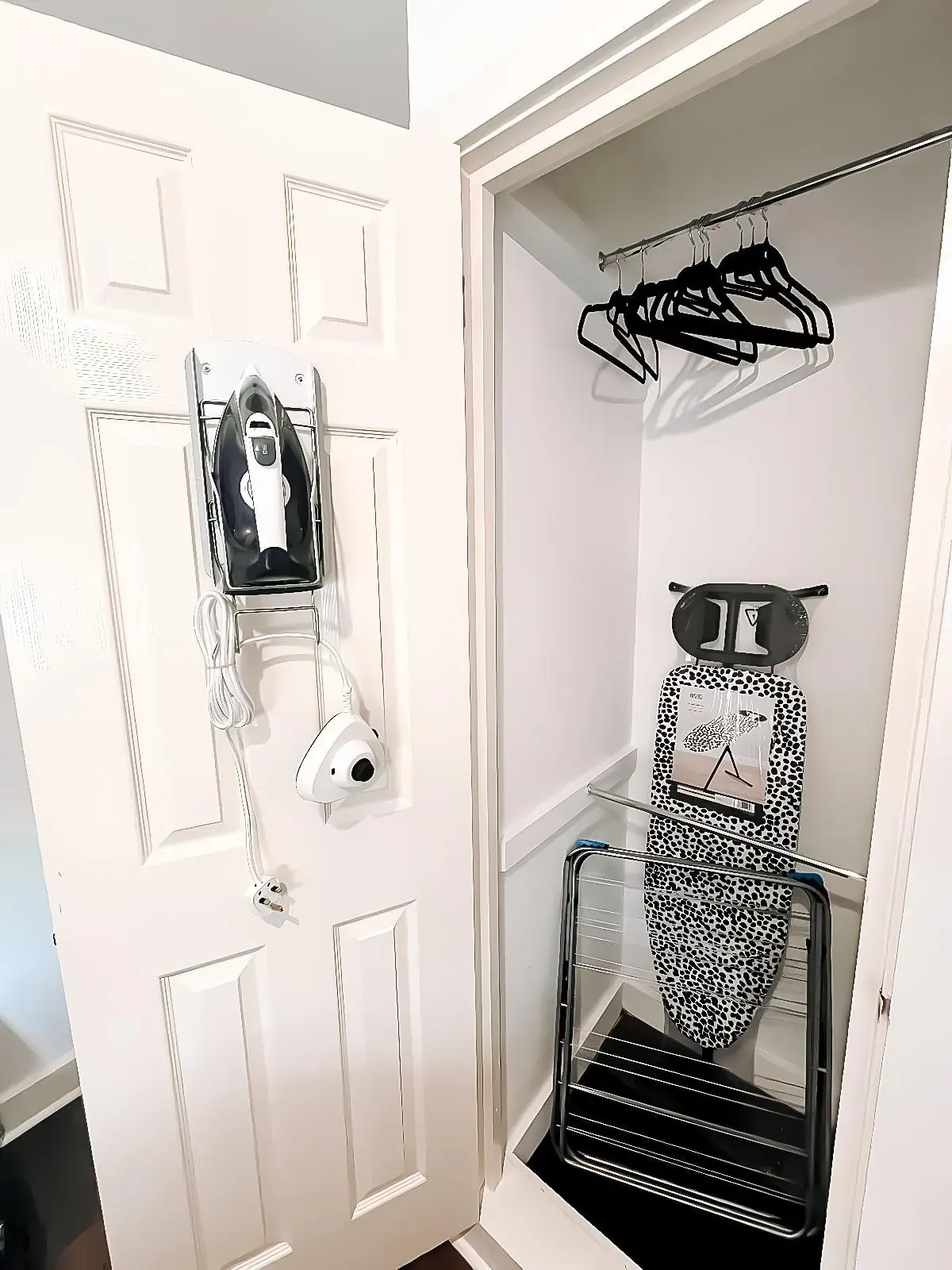 Utility cupboard with iron, ironing board and airer
